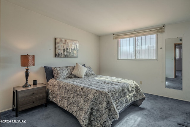 bedroom with carpet and lofted ceiling