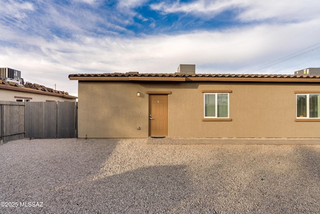 back of house featuring central AC