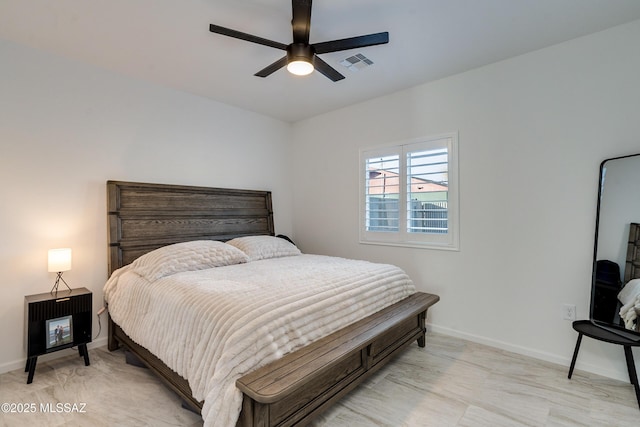 bedroom with a ceiling fan, visible vents, and baseboards