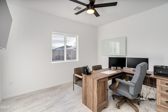 office area featuring a ceiling fan, visible vents, and baseboards