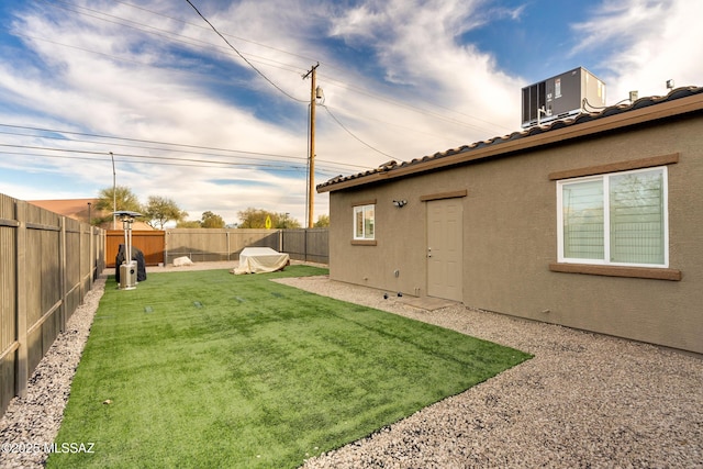 view of yard with central AC unit