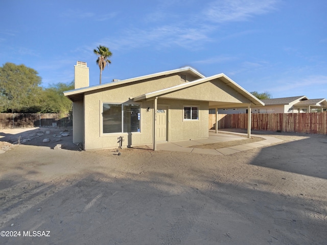 rear view of property featuring a patio