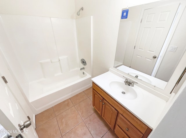 bathroom featuring shower / washtub combination, tile patterned flooring, and vanity