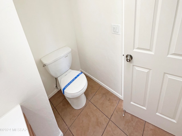 bathroom with tile patterned floors and toilet