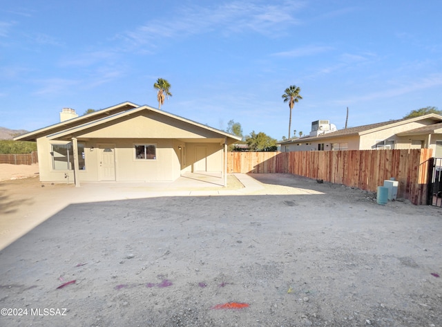 rear view of property with a patio