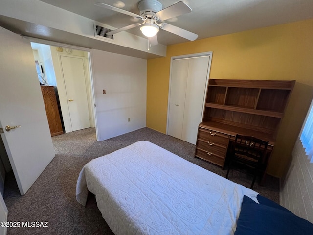 bedroom with dark colored carpet, a closet, and ceiling fan