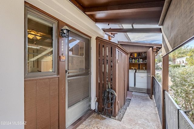 view of patio / terrace with washing machine and clothes dryer