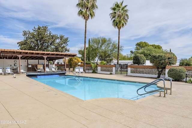 view of swimming pool featuring a patio area