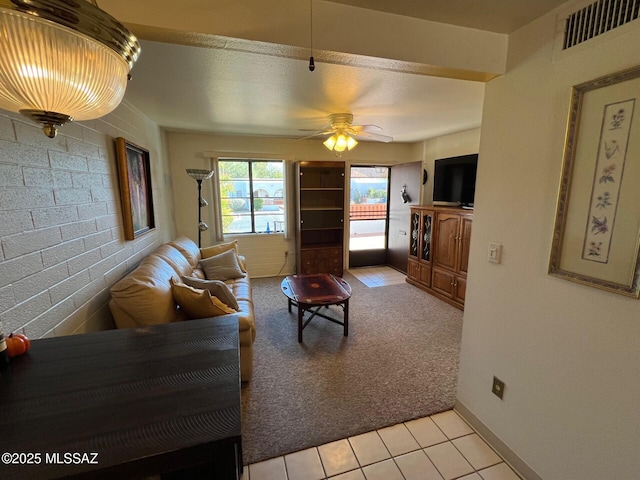 living room featuring ceiling fan and light colored carpet