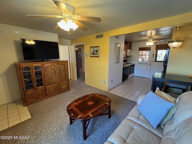 living room with light tile patterned floors and ceiling fan