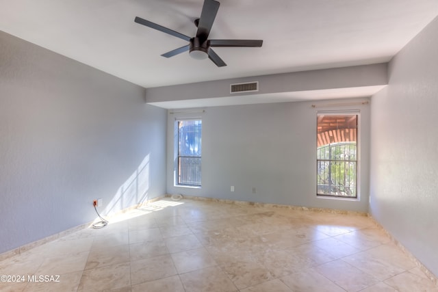 unfurnished room with ceiling fan