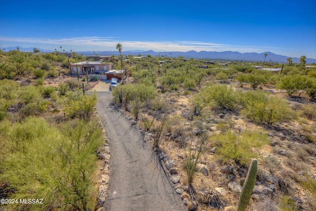 birds eye view of property featuring a mountain view