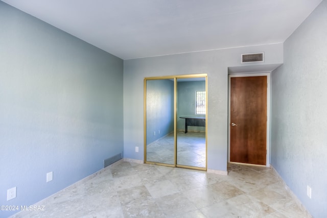 unfurnished bedroom featuring a closet