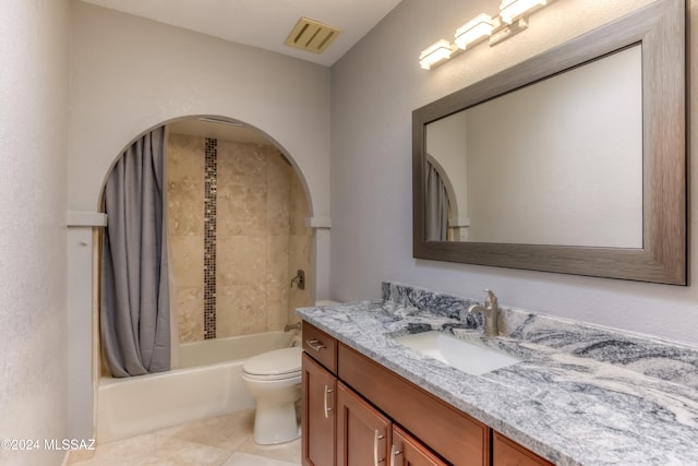 full bathroom featuring tile patterned floors, toilet, vanity, and shower / tub combo