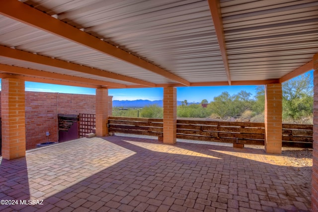 view of patio / terrace featuring a mountain view