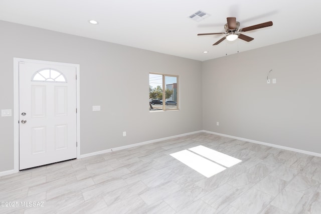 foyer entrance with ceiling fan