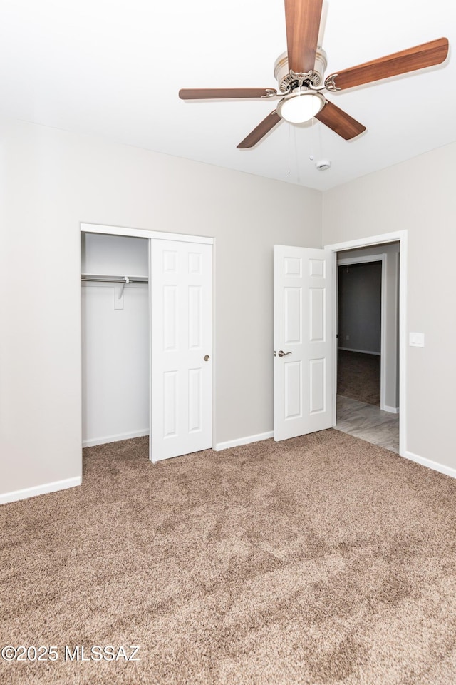 unfurnished bedroom with carpet floors, a closet, and ceiling fan