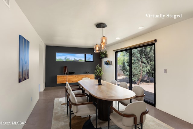 dining area with concrete floors, visible vents, and recessed lighting