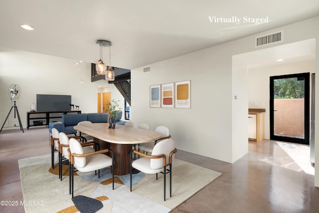 dining space featuring visible vents, concrete flooring, and recessed lighting