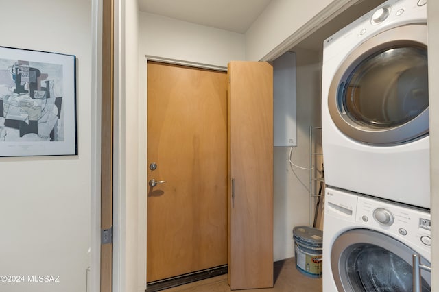 laundry area with stacked washing maching and dryer