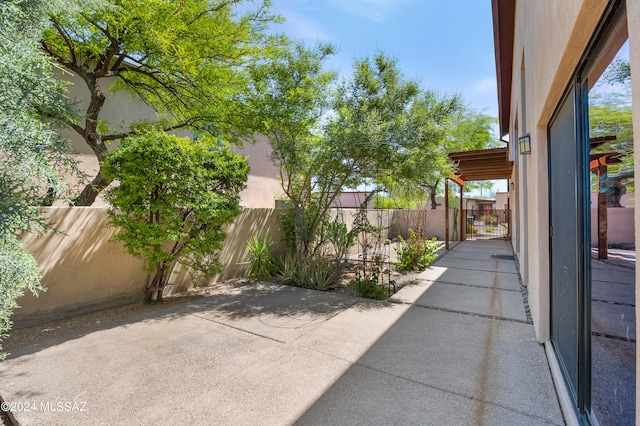 view of patio featuring fence