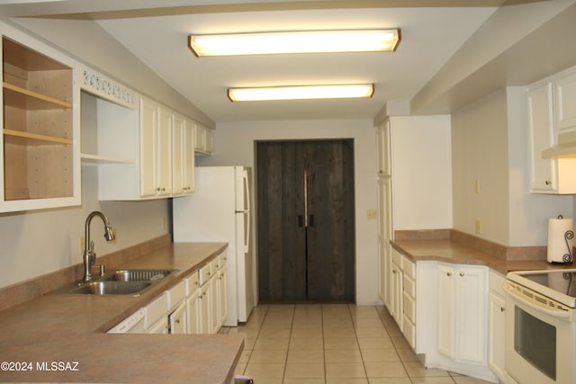 kitchen with white cabinetry, white appliances, light tile patterned floors, and sink