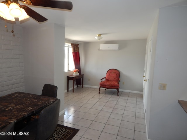 living area with a wall mounted air conditioner, ceiling fan, and light tile patterned floors