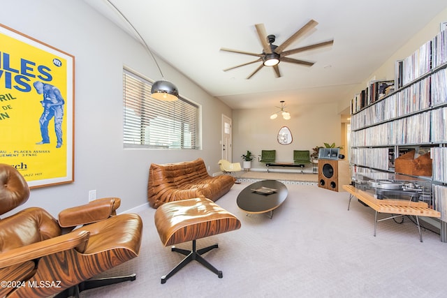 sitting room featuring carpet and ceiling fan