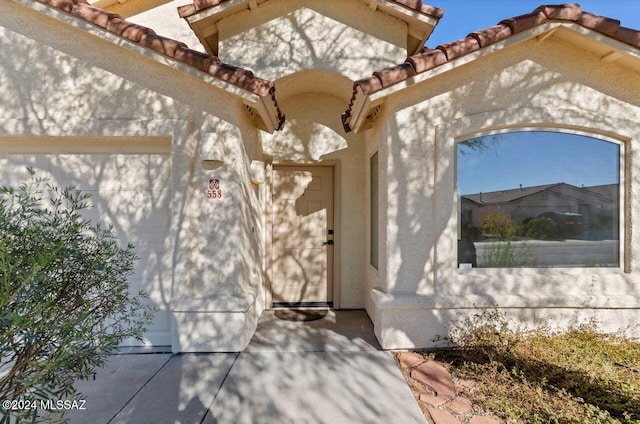 entrance to property featuring a garage