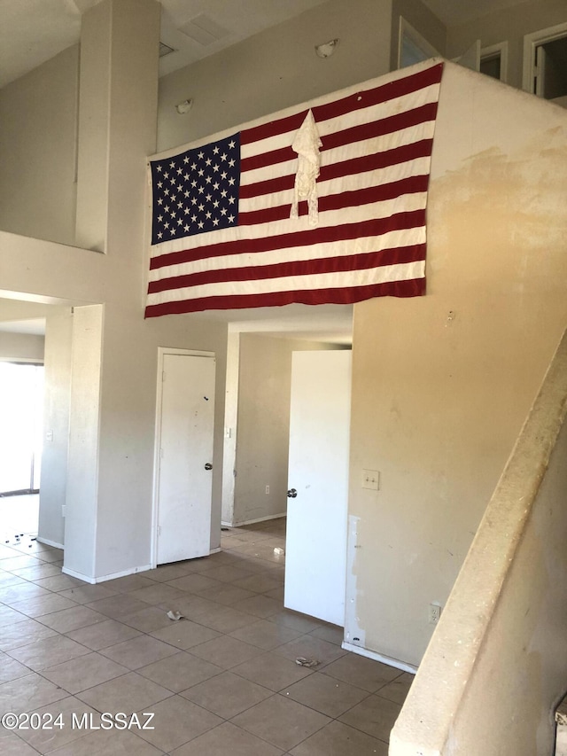 interior space with a towering ceiling