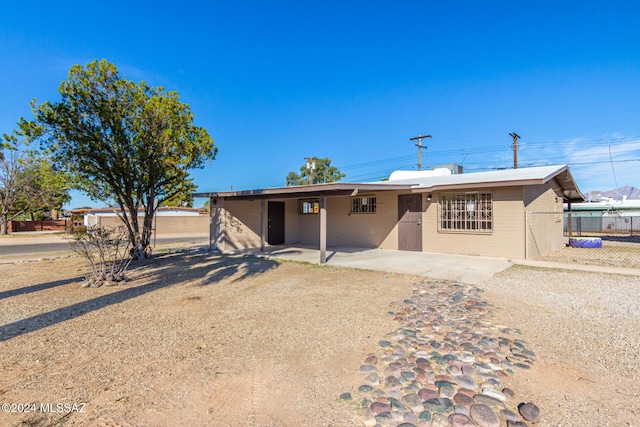 rear view of house featuring a patio