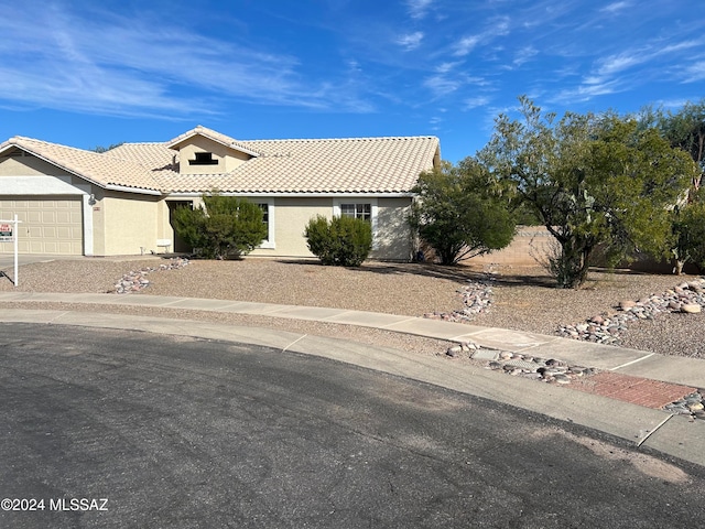 view of front of property featuring a garage