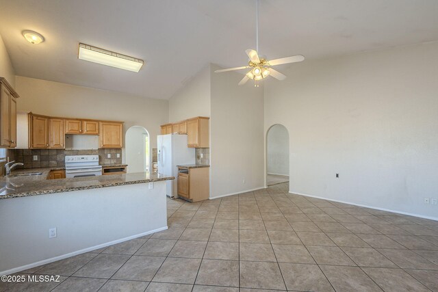 bathroom with tile patterned floors, vanity, and tiled shower / bath