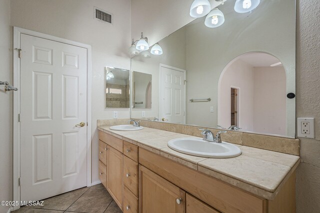 clothes washing area featuring washer hookup, hookup for a gas dryer, dark tile patterned flooring, and electric dryer hookup