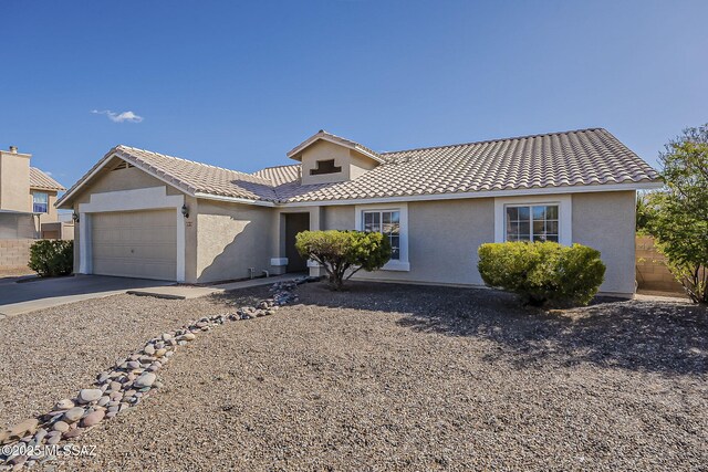 view of front of property with a garage