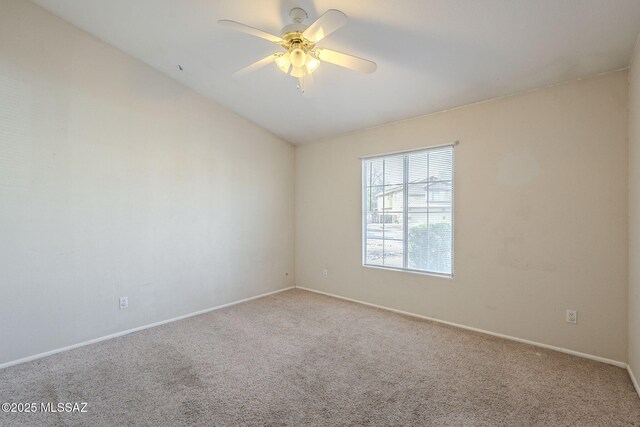 carpeted spare room with a notable chandelier