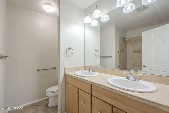 kitchen with ceiling fan, light tile patterned floors, white fridge with ice dispenser, and stone counters