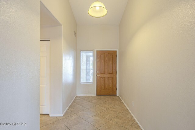 unfurnished room with tile patterned floors