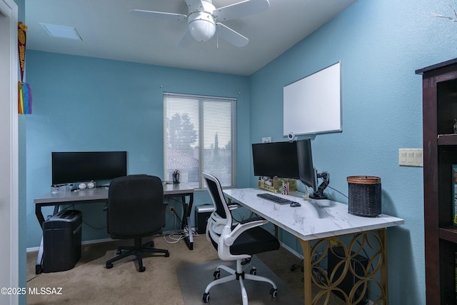 home office with ceiling fan and light colored carpet