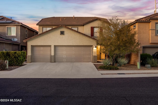 view of front of property with a garage