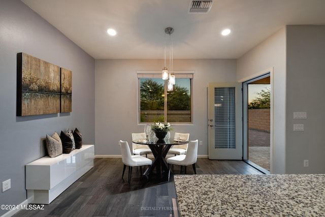 dining area featuring dark hardwood / wood-style flooring and plenty of natural light