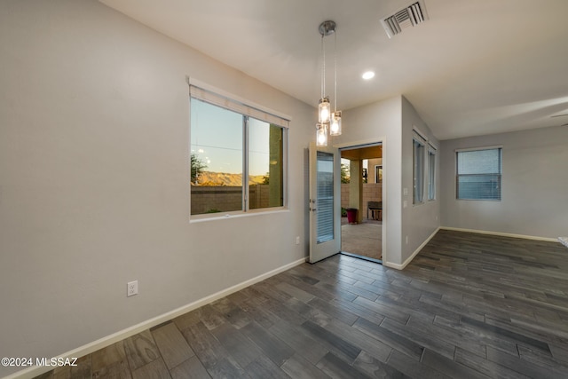 unfurnished room featuring dark hardwood / wood-style floors