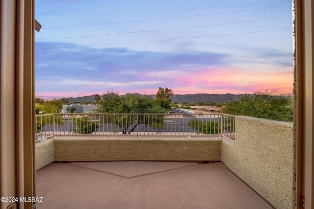 view of balcony at dusk