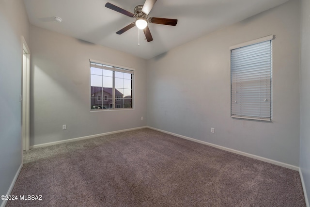 empty room with carpet flooring and ceiling fan