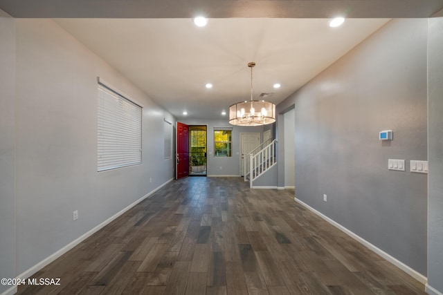 interior space with dark hardwood / wood-style flooring and a chandelier