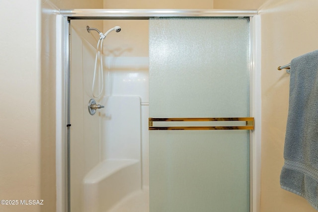 bathroom featuring an enclosed shower