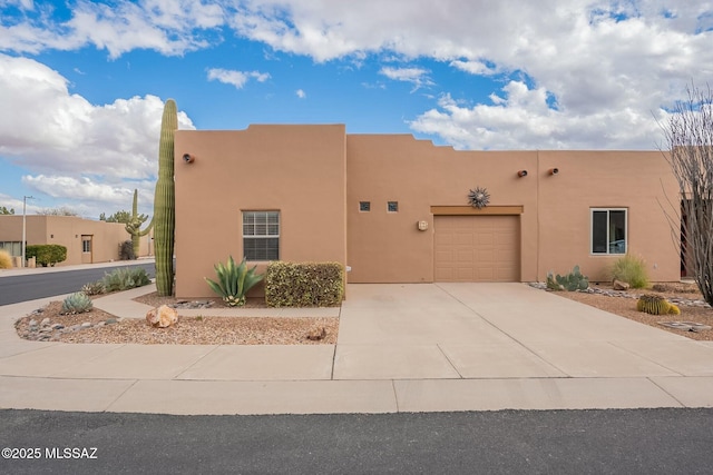 southwest-style home with a garage