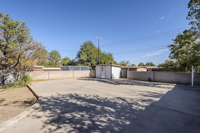 exterior space with a patio and a storage unit