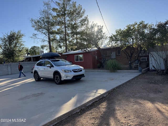 ranch-style home with cooling unit