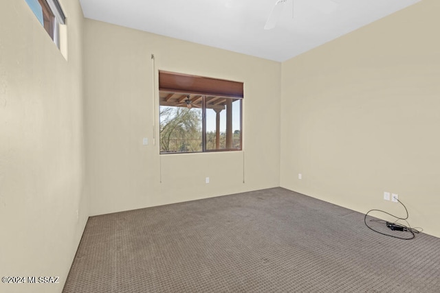 unfurnished room featuring carpet flooring and ceiling fan